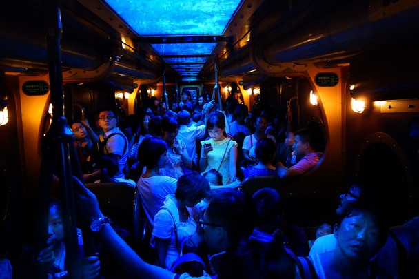 Photo of people in Hong Kong train - Brian Yen - NatGeo