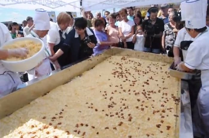 Giant polenta cooked outdoors in Cluj – Napoca, Romania
