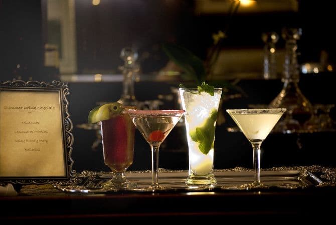How many Romanians drink alcohol and what are their favorite beverages?