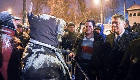 Romania’s President goes out to talk to people protesting against him