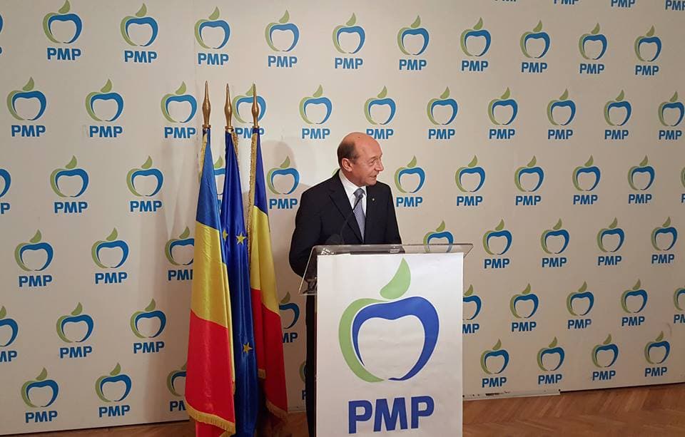Romania's former president and former interior minister merge parties