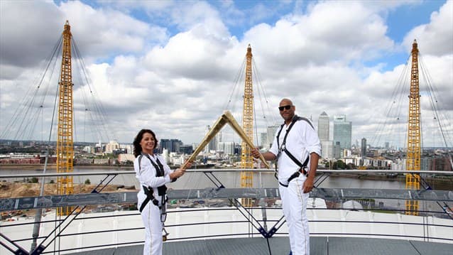 Romanian gymnast Nadia Comaneci part of London Olympics torch relay