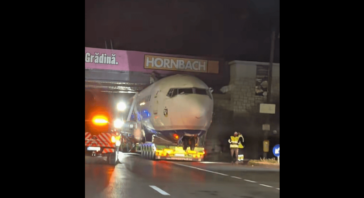 Decommissioned plane gets stuck under a bridge.