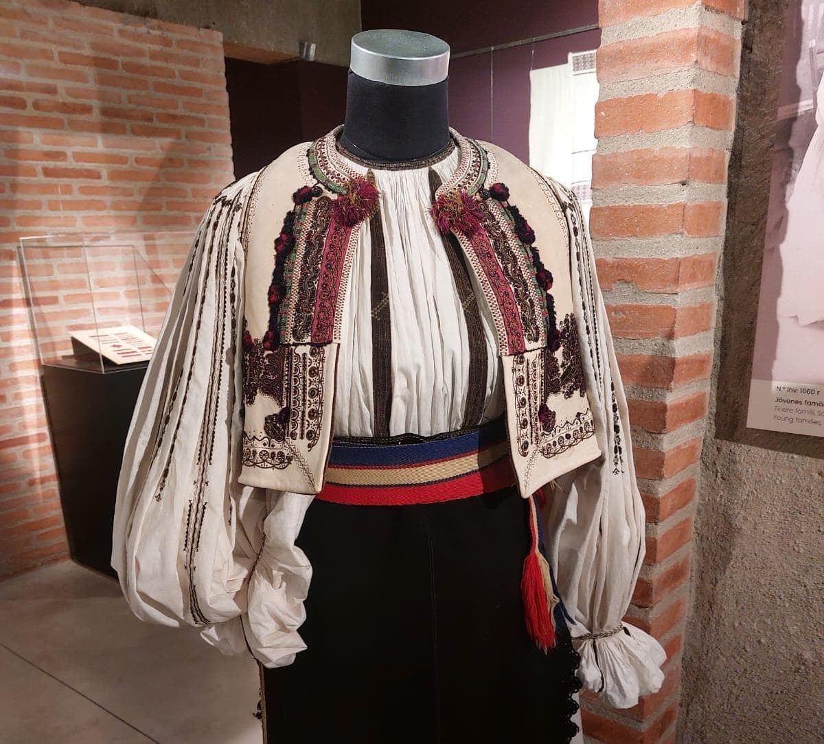 Traditional costumes and shirts from Romania's national heritage, on display in Madrid