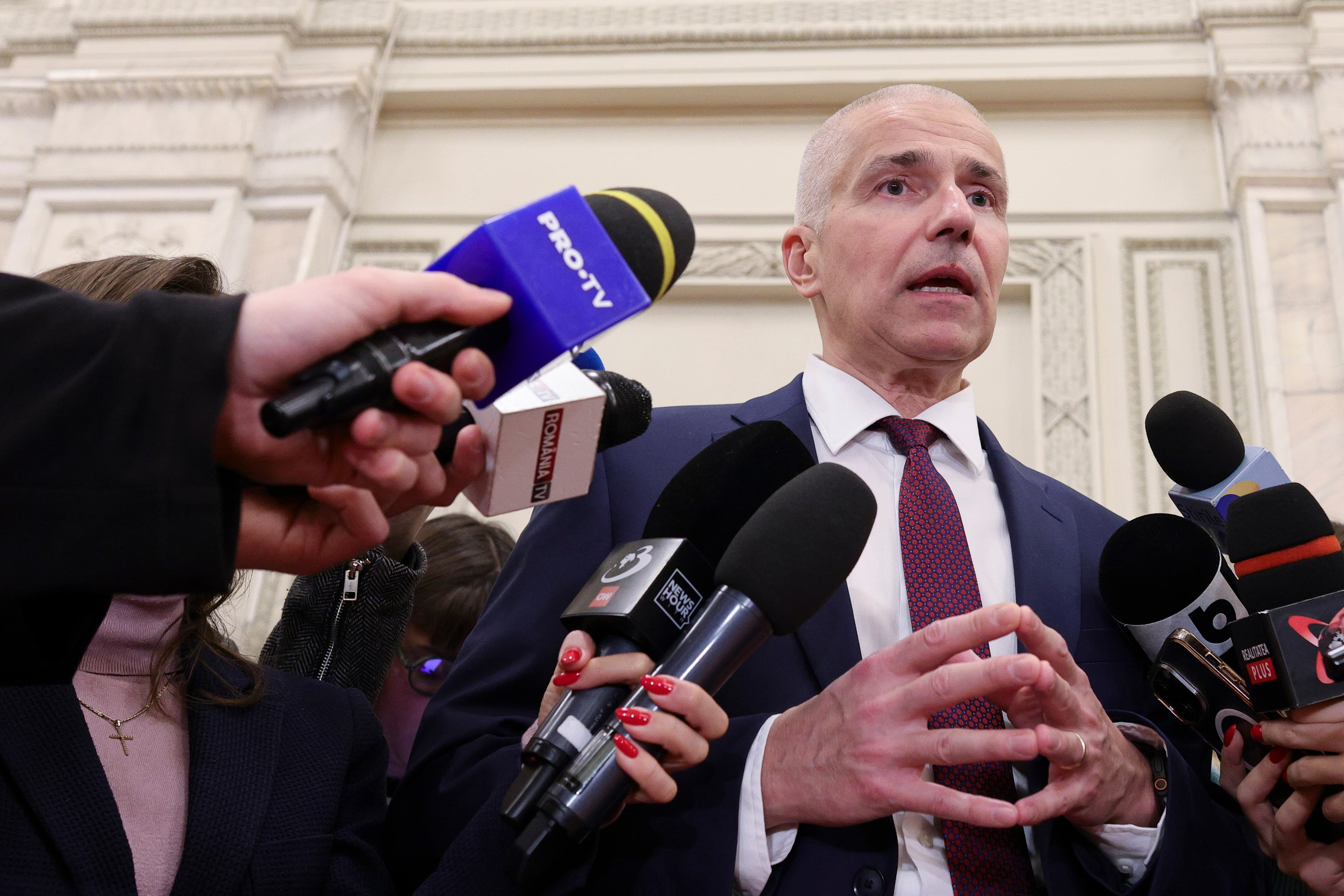 Romanian justice minister accused of plagiarism denies wrongdoing, threatens lawsuit