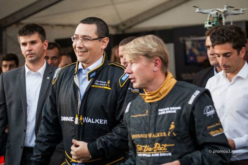 Formula One champion Mika Hakkinen and Romanian PM Ponta team up for racing demonstration in Bucharest
