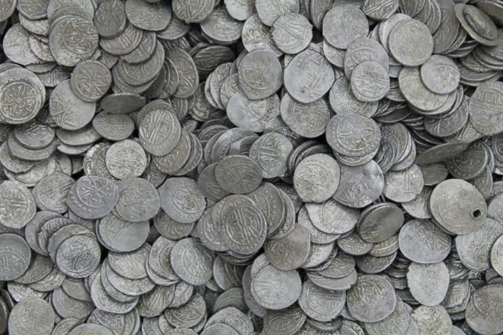 Young Romanian gives museum largest silver coin treasure ever found in the country