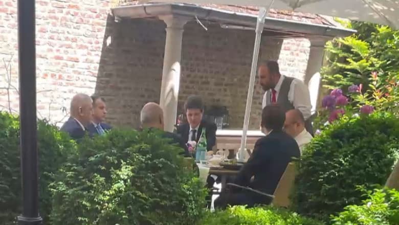 Grl. (R) Pahontu eating at same table with President Dan and other politicians, in Brussels
